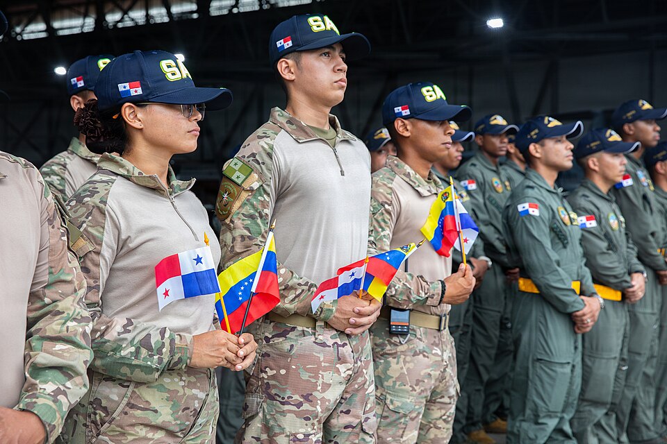 Members of the Sistema Nacional de Protección Civil Search and Rescue stand in formation holding the Panamanian and Venezuelan flags in Veracruz, Panama, June 26, 2026. Panama is providing humanitarian aid to support Venezuelan communities affected by earthquakes. (U.S. Army photo by Pfc. Oshon Trow