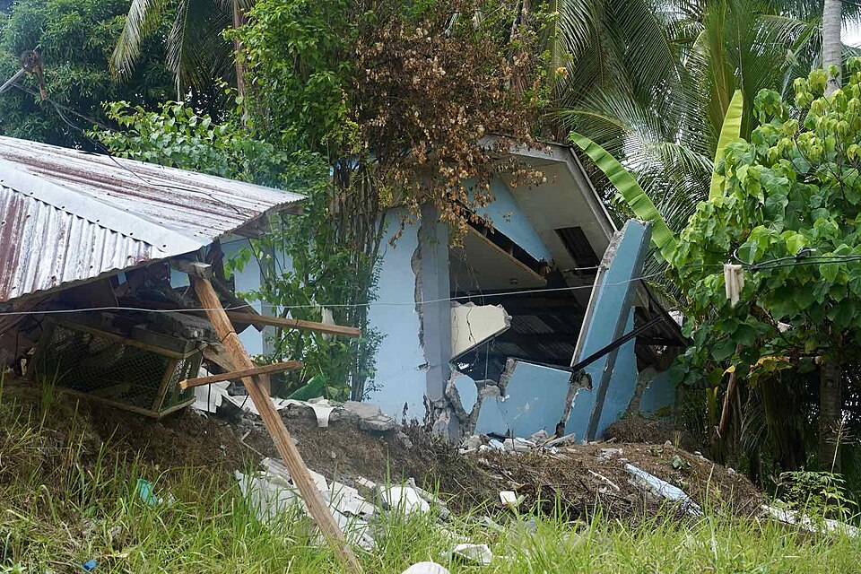 Damage to homes, a community hospital, and Barangay Hall in San Isidro, Manay, Davao Oriental caused by the earthquake can be seen