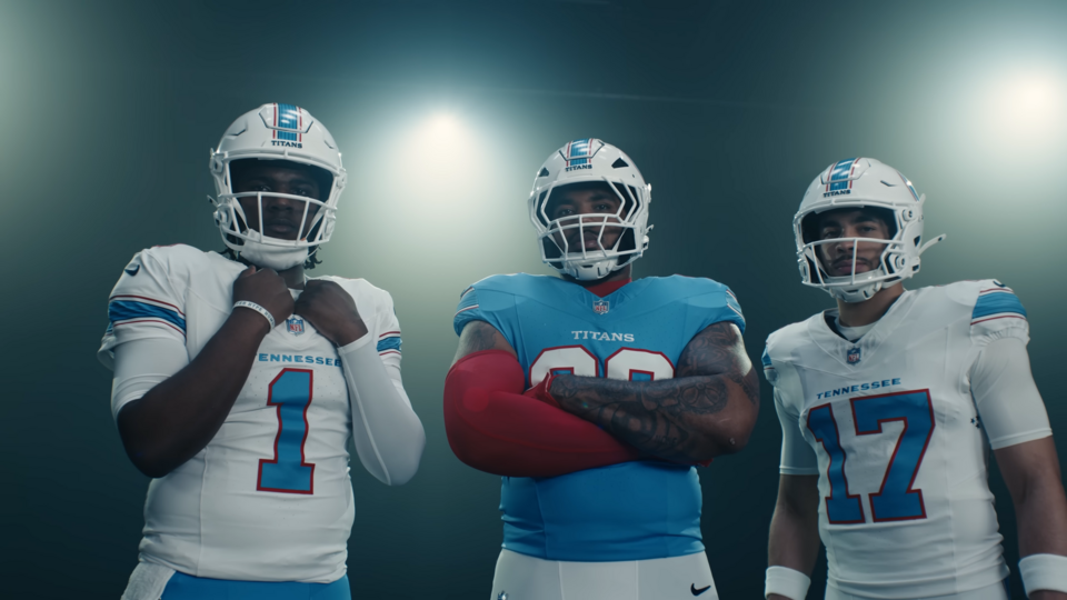 Tennessee Titans players (left to right), Cam Ward, Jeffery Simmons, and Chimere Dike, in a photo shoot for the team's official jersey reveal in March 2026. Image is a screen shot of Youtube video ~ 07:45