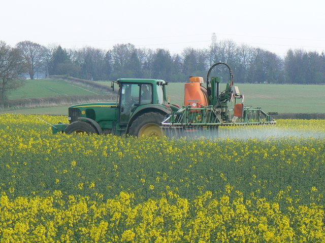 Crop spraying near St Mary Bourne. I know not whether the spray is herbicide, pesticide or fertiliser. The crop is rapeseed. Coming into full flower soon, the air was filled with its rather rank scent. The pylons in the background are about a kilometre south of the viewpoint.