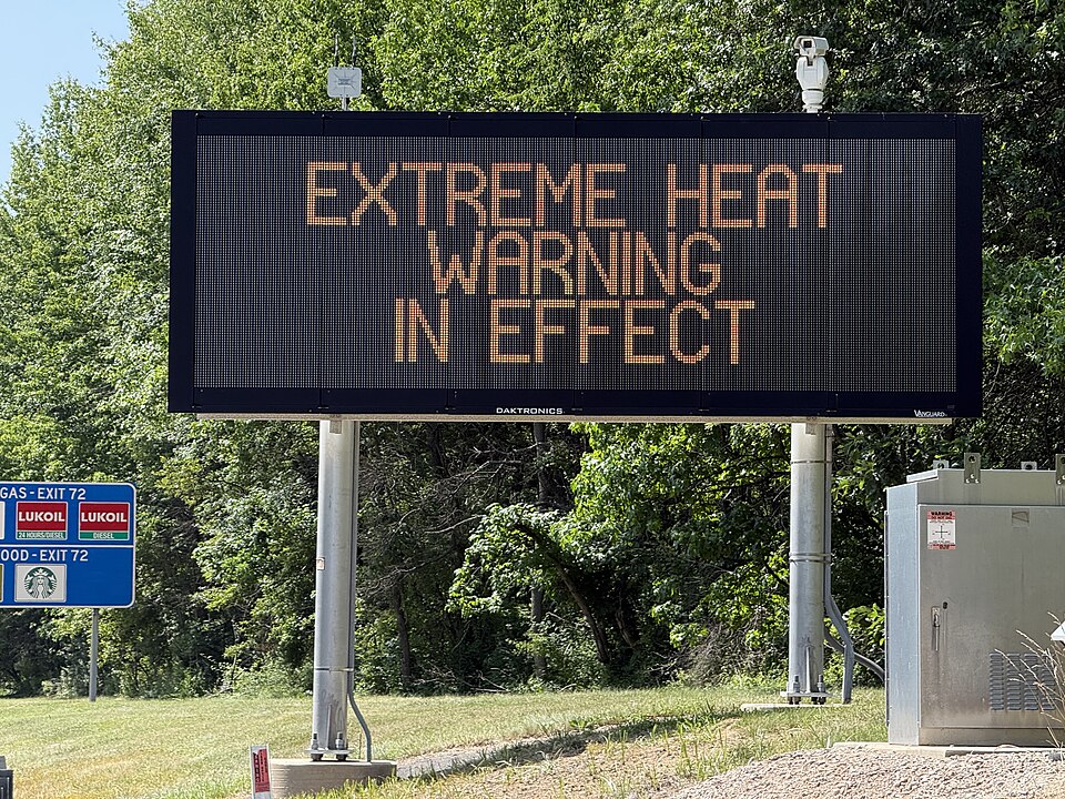 Variable message sign displaying "Excessive Heat Warning In Effect" during triple-digit heat along northbound Interstate 295 just south of Exit 72 in Hopewell Township, Mercer County, New Jersey