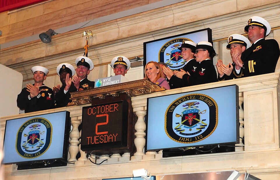 NEW YORK (Oct. 2, 2012) Maureen Murphy, ship sponsor for the guided-missile destroyer Pre-Commissioning Unit (PCU) Michael Murphy (DDG 112), rings the opening bell at the New York Stock Exchange with the ship's commanding officer, Cmdr. Thomas Shultz, and members of the crew. Maureen Murphy is the m