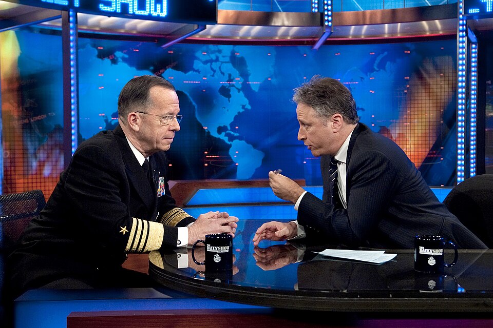 Television host Jon Stewart interviewing Admiral Michael Mullen during a taping session of The Daily Show.