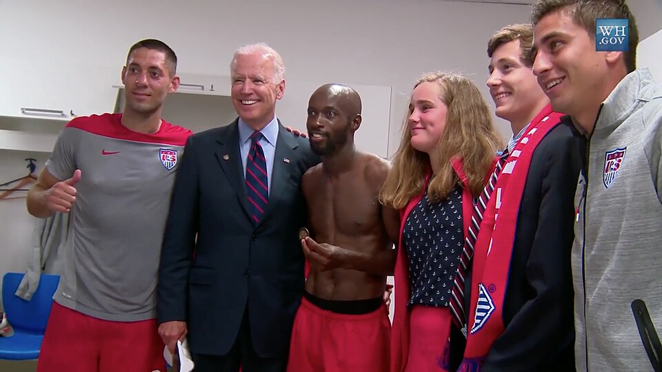 Vice President Joe Biden posing with Clint Dempsey and DaMarcus Beasley following the United States men's national team's 2-1 victory over Ghana in the 2014 World Cup