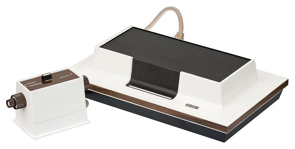 The Magnavox Odyssey, the very first video game console.  Released in 1972, the Odyssey was a simple and crude device that generated shapes on the television that could be controlled and interacted with.  It only produced black and white graphics and had no sound, but was limited to only using discr