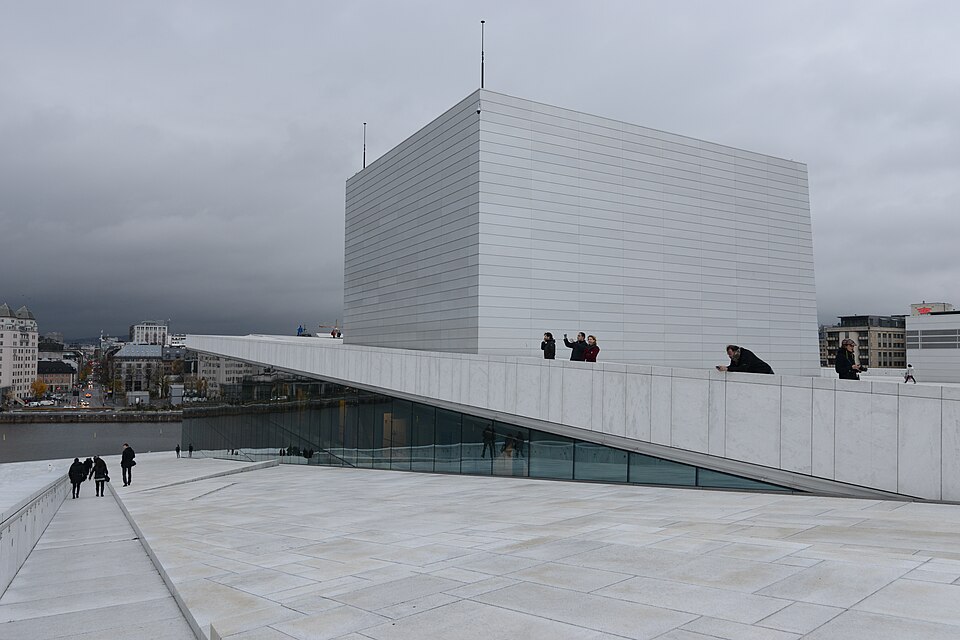 The Oslo Opera House (Norwegian: Operahuset) is the home of The Norwegian National Opera and Ballet, and the national opera theatre in Norway. The building is situated in the Bjørvika neighborhood of central Oslo, at the head of the Oslofjord. It is operated by Statsbygg, the government agency which