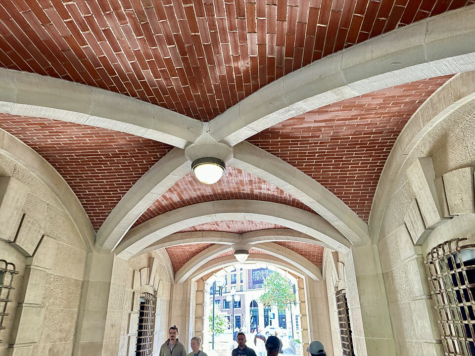 Built in 1904 and expanded to its present size in 1910, this Renaissance Revival-style building was designed by George Mason and Albert Kahn to serve as the home of the Engineering Department of the University of Michigan.  The building is clad in red brick with a hipped red terra cotta tile roof fe