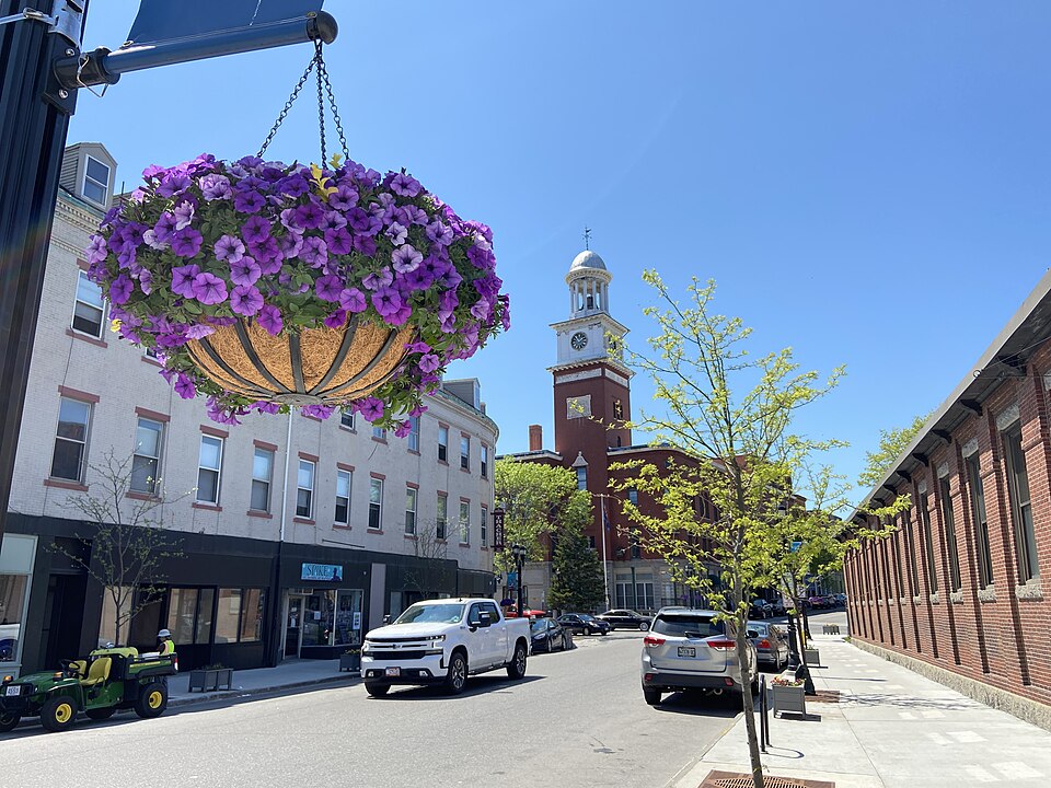Downtown Biddeford, Maine featuring City Hall and a hanging flowerpot.