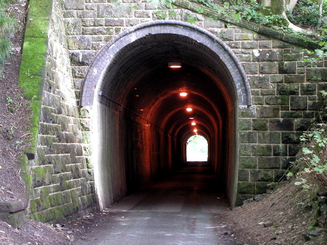 Old railway tunnel - new road tunnel. This old railway tunnel is now used as a road/footpath in the Manifold Valley.