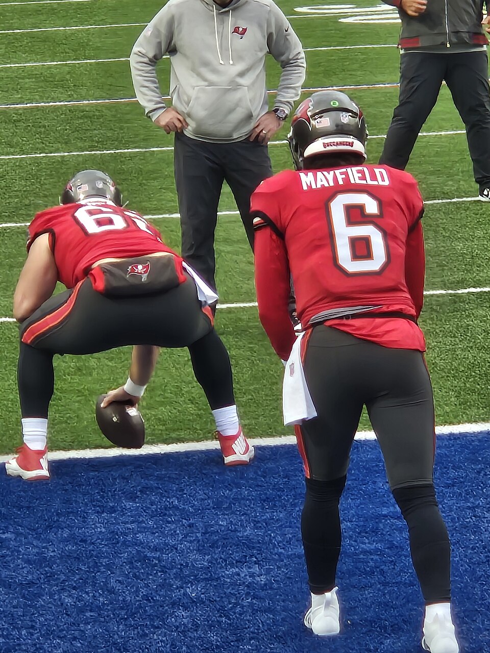 Tampa Bay Buccaneers quarterback Baker Mayfield and center Graham Barton warming up before playing Buffalo Bills