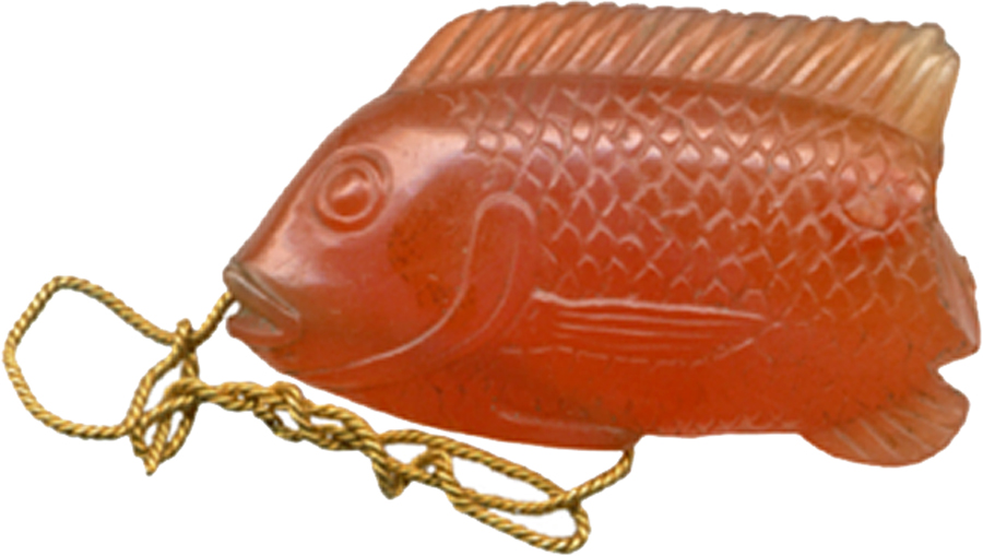 Fish were not only a major staple in the diet of the ancient Egyptians, but many species were also related to gods. This exceptional fish pendant depicts a "Tilapia nilotica," a common species in the Nile. It was appreciated for its taste, and was also regarded as a symbol of rebirth and resurrectio