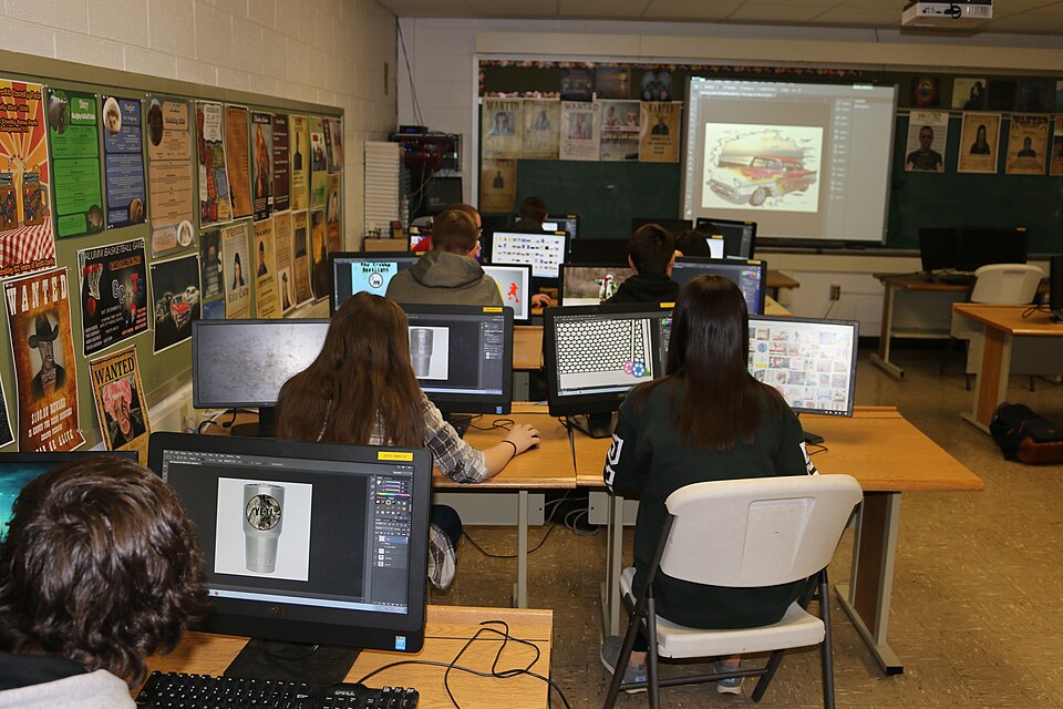 Scott County:Graphic Imaging Technology I, II, III : 10th–12th  Grades; Using Adobe Photoshop and Adobe Illustrator to Create Yeti cup labels. Scott County Career and Technical Center