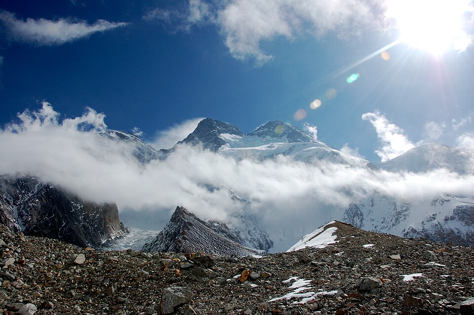 Broad Peak from Godwin-Austen Glacier: Broad Peak North on the links (Behind clouds), Broad Peak Central (centre left) and Broad Peak Main (centre right)