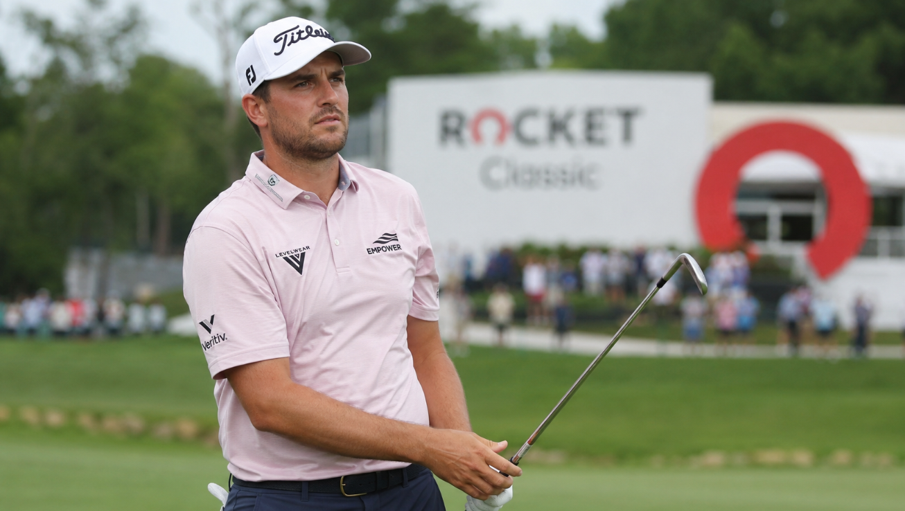 Professional golfer Davis Riley holds an iron while watching his shot during the Rocket Classic at Detroit Golf Club.