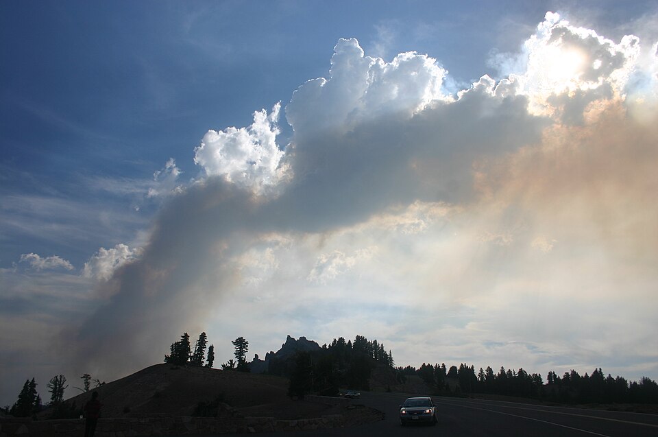 The Sun shining from behind wildfire smoke, revealing its hue.