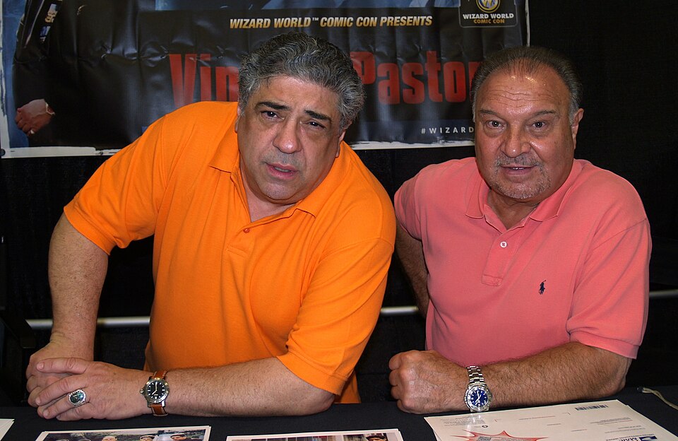 American actor Vincent Pastore (left) and his manager, Stormy Avallone, at the 2013 Wizard World New York Experience Comic Con, at Pier 36 in Manhattan, June 30, 2013.

This photo was created by Luigi Novi. It is not in the public domain, and use of this file outside of the licensing terms is a copy