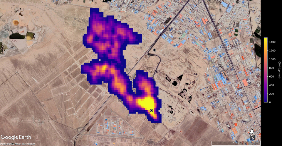A methane plume flows from a landfill south of Tehran, Iran.