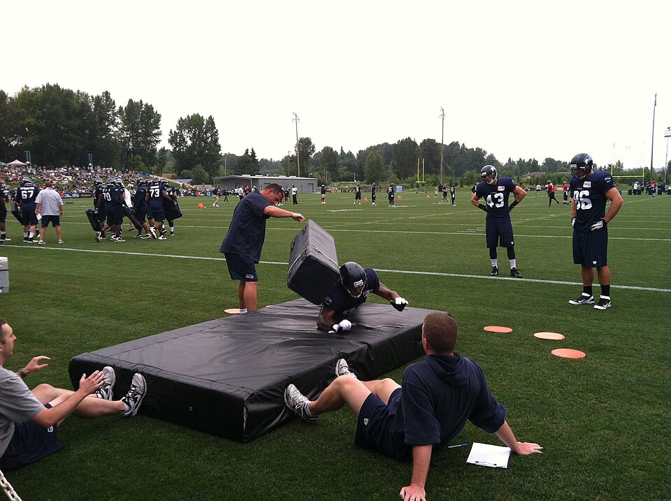 Seattle Seahawks players Cooper Helfet (#43) and Zach MIller (#86) watch as an unidentified player goes through a drill at training camp in Virginia Mason Athletic Center, Renton, Wash. on August 7, 2012.
