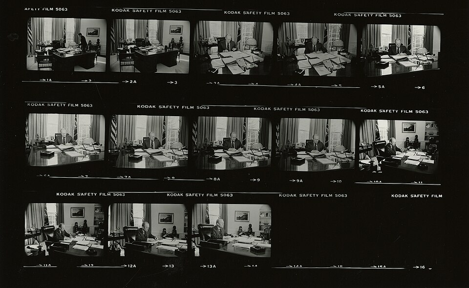 Signing Ceremony for Executive Order 11905, Proposing Legislation to Reform the US Foreign Intelligence Community. Ford seated at desk, signing
papers; various angles and distances; O'Donnell in frame 2 only.