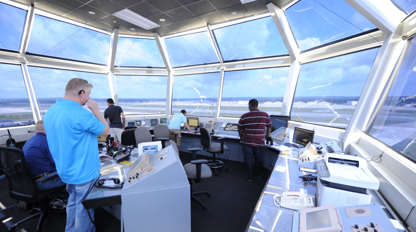 Air traffic controllers direct air and ground operations atop the new air traffic control tower June 11, 2013, at Pope Field, N.C.