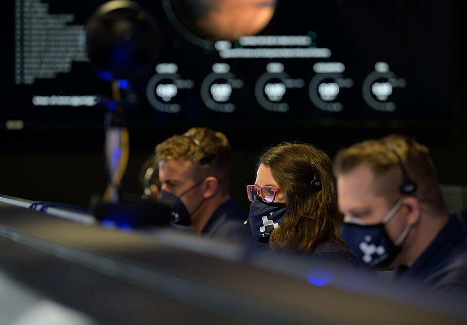 Members of NASA’s Perseverance Mars rover team study data on monitors in mission control, Thursday, Feb. 18, 2021, at NASA's Jet Propulsion Laboratory in Pasadena, California. A key objective for Perseverance’s mission on Mars is astrobiology, including the search for signs of ancient microbial life