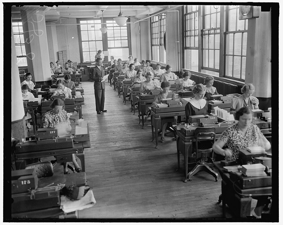 Title: Baltimore, MD. For every Social Security Account Number issued an "emploee master card" is made in the Social Security Board Records Office. Identifying data, given on the application blank , Form SC-5[?], is transferred to this master card in the form of up-ended quadrangular holes, punched