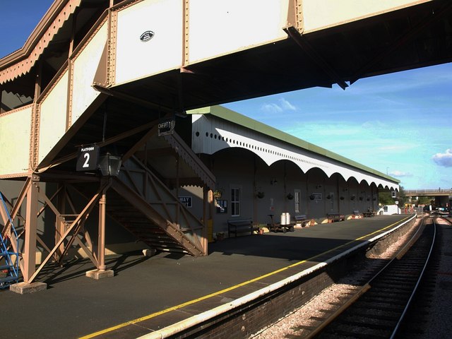 Churston station. A view through an open carriage window of the northbound platform at the station. "The station was opened in 1861 as the temporary terminus of the Kingswear line. It was named Brixham Road becoming Churston on the 1st May 1868, just after the opening of the Brixham branch in Februa