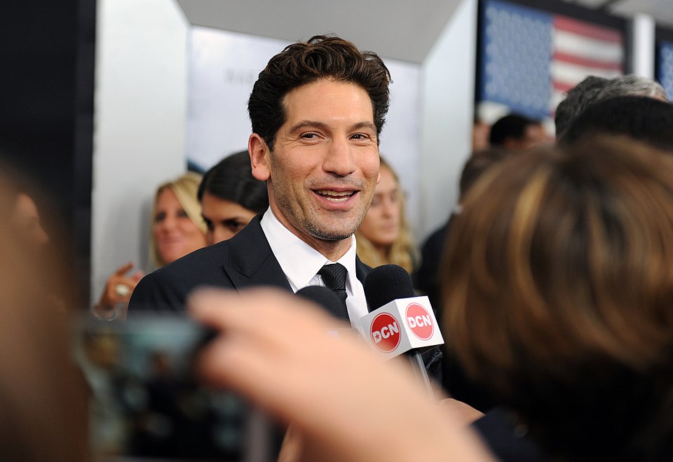 Actor Jon Bernthal, who plays the part of “Coon-Ass/Grady Travis, gives interviews with the media on the “Red Carpet” during the world premiere of the movie Fury at the Newseum in Washington D.C.  (Department of Defense photo by Marvin Lynchard)