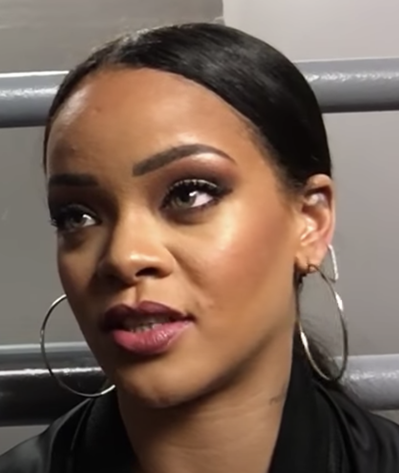 Rihanna interviewed by Tai Lopez while behind the scenes of a show she is performing