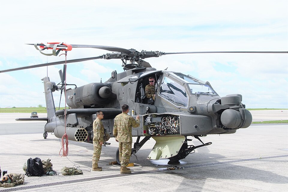 U.S. Soldiers assigned to Company D, 1st Battalion, 3rd Aviation Regiment (Attack Reconnaissance) conduct maintenance on an AH-64 Apache helicopter at Katterbach Army Airfield, Germany, June 18, 2020. (U.S. Army photo by Charles Rosemond)