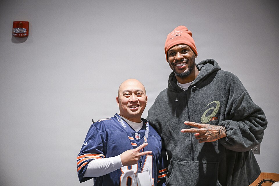 GREAT LAKES, Ill. (Dec. 11, 2025)– Chicago Bears cornerback Nahshon Wright poses for a photo with Naval Station Great Lakes (NSGL) Executive Officer Cmdr. Julius Dabu during a live screening of the "Bears Weekly" radio show at Halas Hall in Lake Forest, Ill. The event, held in partnership with the C