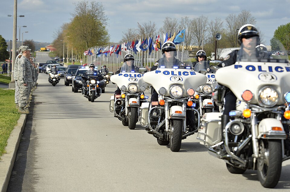 Law enforcement officers escort the remains of U.S. Army Staff Sgt. Christopher M. Ward April 12, 2013, at McGhee Tyson Air National Guard Base, Tenn. Ward died April 6, 2013, when an improvised explosive device detonated while he was traveling in a convoy in Afghanistan. (DoD photo by Master Sgt. K