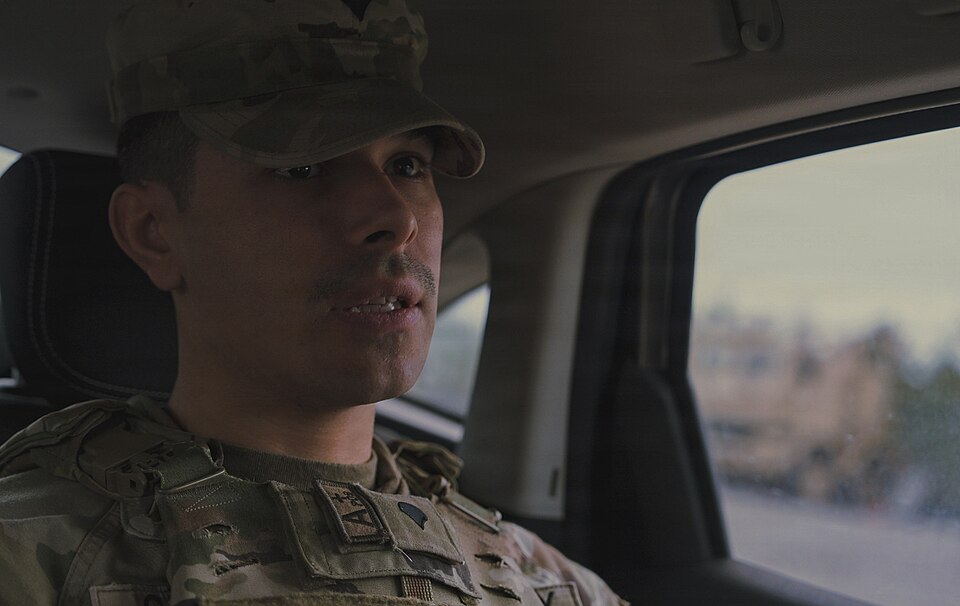U.S. Army Spc. Mark Garcia, a military police Soldier with the 327th Military Police Battalion, 102nd Military Police Company, conducts a routine base patrol at Camp Adazi, Latvia, on Dec. 10, 2025. The patrols maintained a visible security presence and ensured traffic safety around the base. Their