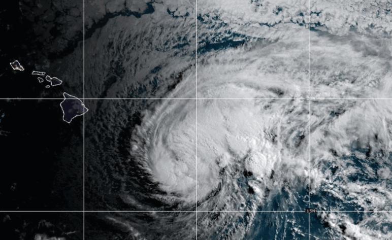 NOAA satellite image showing Tropical Storm Lala swirling over the Pacific Ocean southeast of Hawaii, with the Hawaiian Islands visible to the northwest.