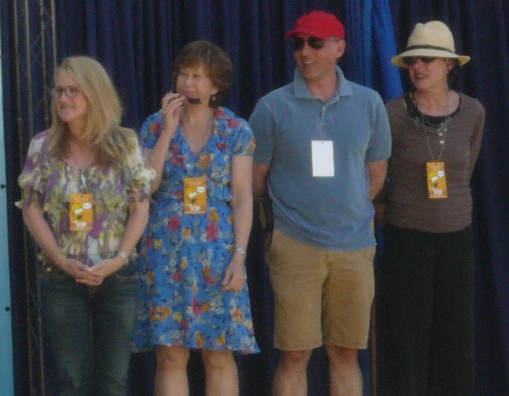 The cast of The Simpsons attends the unveiling of The Simpsons stamps. Left to right: Nancy Cartwright (Bart Simpson), Yeardley Smith (Lisa), Dan Castellaneta (Homer) and Julie Kavner (Marge).