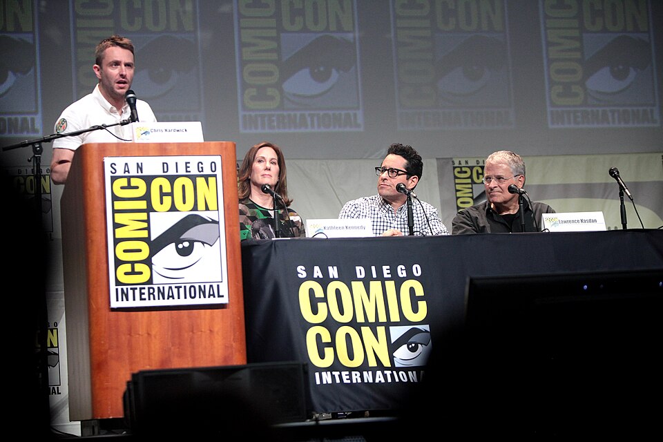 Chris Hardwick, Kathleen Kennedy, J. J. Abrams and Lawrence Kasdan speaking at the 2015 San Diego Comic Con International, for "Star Wars: The Force Awakens", at the San Diego Convention Center in San Diego, California.

Please attribute to Gage Skidmore if used elsewhere.