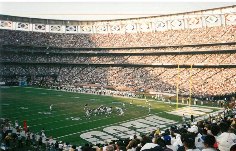 October 30th, 1994, Jack Murphy Stadium. The San Diego Chargers (navy blue shirts) are on offense, preparing to run a play against the Seattle Seahawks in Week 9 of the 1994 NFL season. The play was a 2nd and 4 from the Seattle 10, early in the 4th quarter. Natrone Means, the lone back, gained two y
