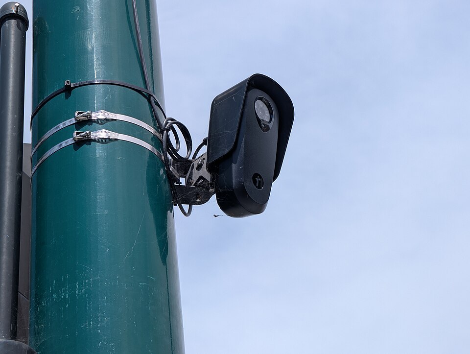 A zoomed-in shot of a Flock Safety ALPR camera looking southwest towards B Street in Hayward, California.