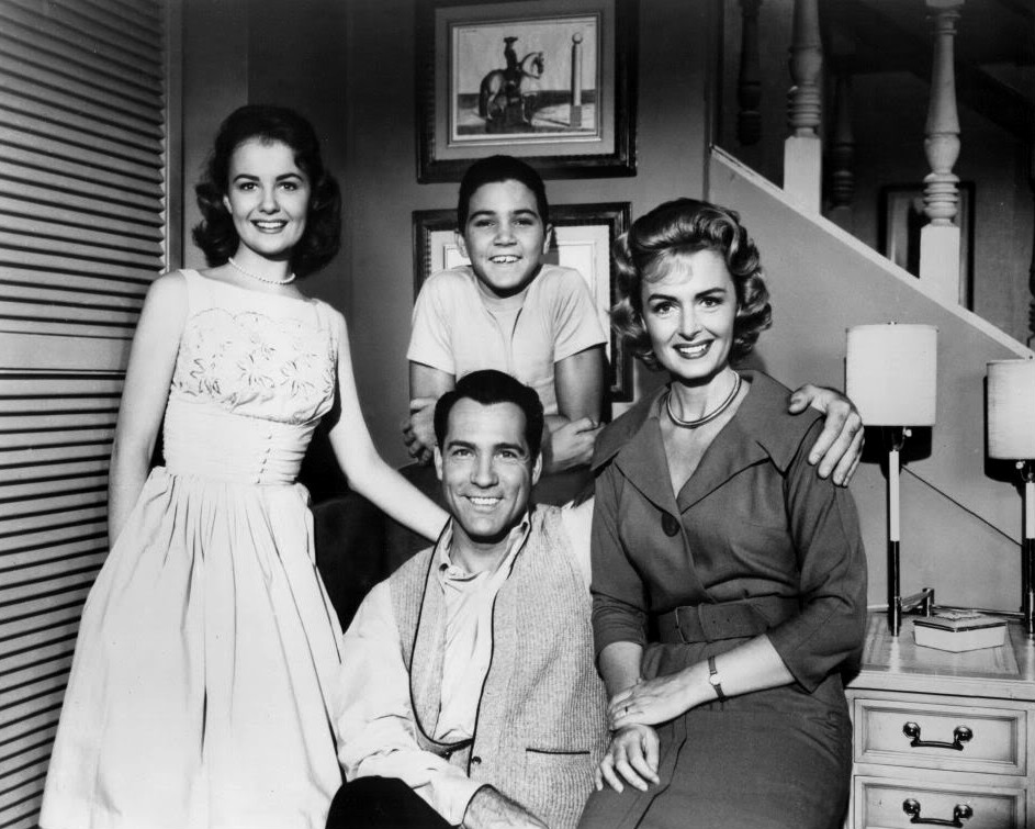 Cast photo from the television program The Donna Reed Show.  Standing-Shelley Fabares and Paul Petersen.  Seated-Carl Betz and Donna Reed.
