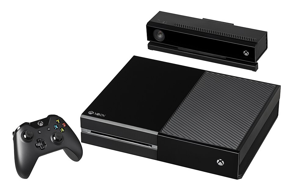 The Xbox One console, shown with the controller and the Kinect.  Released in 2013 in North America and select markets, it is the third video game console made by Microsoft and succeeds the Xbox 360.