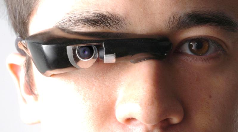 Picture of C. Aimone with an injection moulded en:eyetap that was also shown at the en:Smithsonian, and will be on exhibit at digifest 2004. This picture was made possible by way of the Nikon D2h, interfaced to a body-borne computer system, controlling a number of en:Metz Mecablitz flash lamps. The