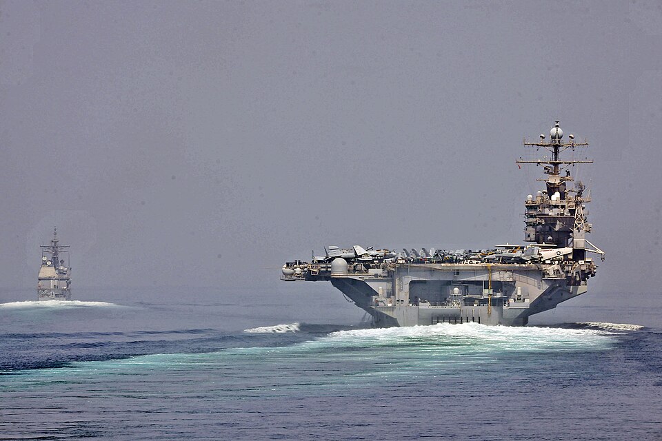 STRAIT OF HORMUZ (May 11, 2012) The guided-missile cruiser USS Cape St. George (CG 71) and the aircraft carrier USS Abraham Lincoln (CVN 72) transit the Strait of Hormuz. Both ships are deployed to the U.S. 5th Fleet area of responsibility conducting maritime security operations, theater security co