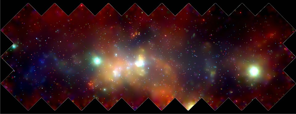 This 400 by 900 light-year mosaic of several Chandra images of the central region of our Milky Way galaxy reveals hundreds of white dwarf stars, neutron stars, and black holes bathed in an incandescent fog of multimillion-degree gas. The supermassive black hole at the center of the Galaxy is located