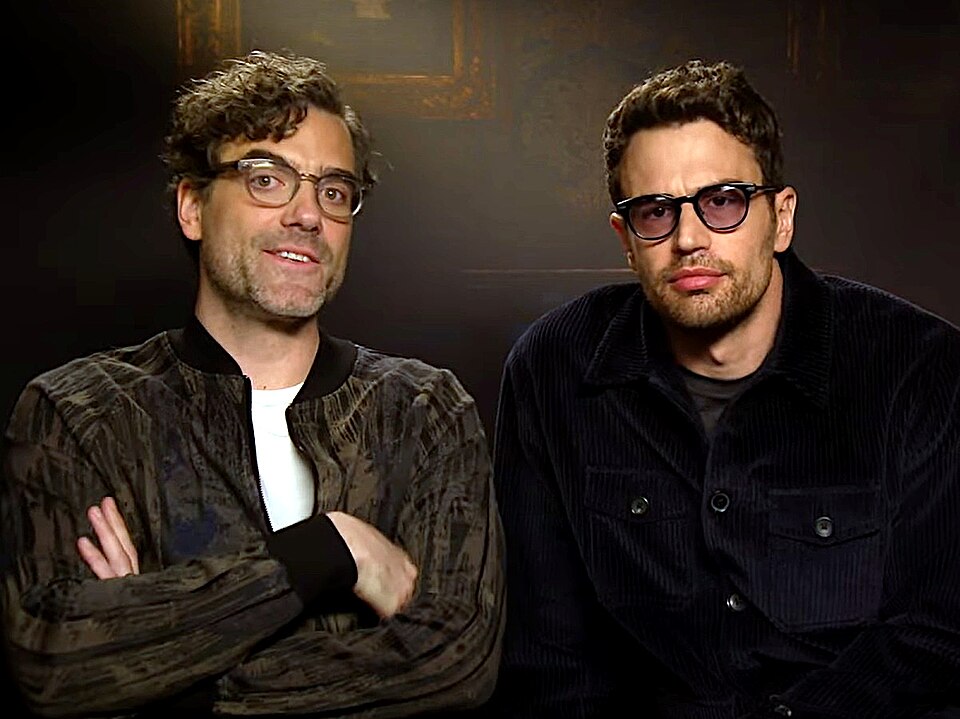 Daniel Ings and Theo James in 'The Gentlemen, Theo James, Daniel Ings, Why mum left the screening, humiliating family, cozy homes', uploaded to Youtube by the interviewer Margaret Gardiner under CC-BY-3.0 Unported Licence on March 8, 2024.