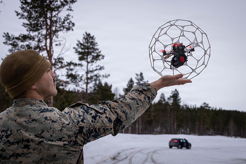 U.S. Marine Corps Cpl. Jayden Flora, the innovation lead with Unmanned Systems Center of Excellence, 2nd Marine Division, lifts an Orb Jawbreaker drone in Setermoen, Norway, March 17, 2026. Researchers with Operational Energy Innovation, out of the U.S. Naval Research Laboratory, tested their Data A