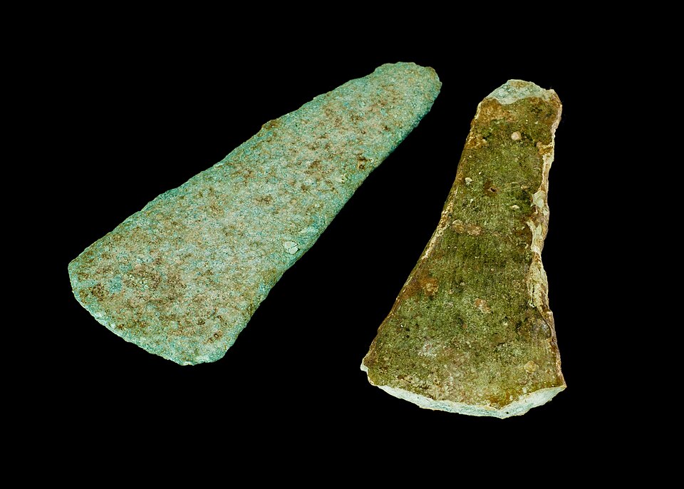 Early Bronze Age associated flat axes
1. Flat axe - Type Migdale, probable Variant Biggar (Class 3F) Dimensions: surviving length 142.9mm; surviving blade width 58.6mm; surviving butt width21.1mm; maximum thickness 8.2mm; surviving weight (prior to conservation) 253.9g.
This is a largely complete bu