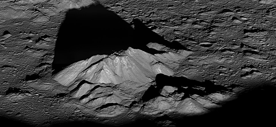 Tycho crater's central peak complex casts a long, dark shadow near local sunrise in this spectacular lunar-scape. The dramatic oblique view was recorded by the Lunar Reconnaissance Orbiter. The rugged complex is about 15 kilometres wide, formed in uplift by the giant impact that created the well-kno
