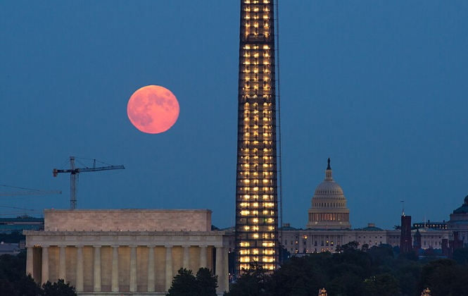 A full moon, known as a Harvest Moon, rises over Washington, Thursday, Sept. 19, 2013, in Washington.