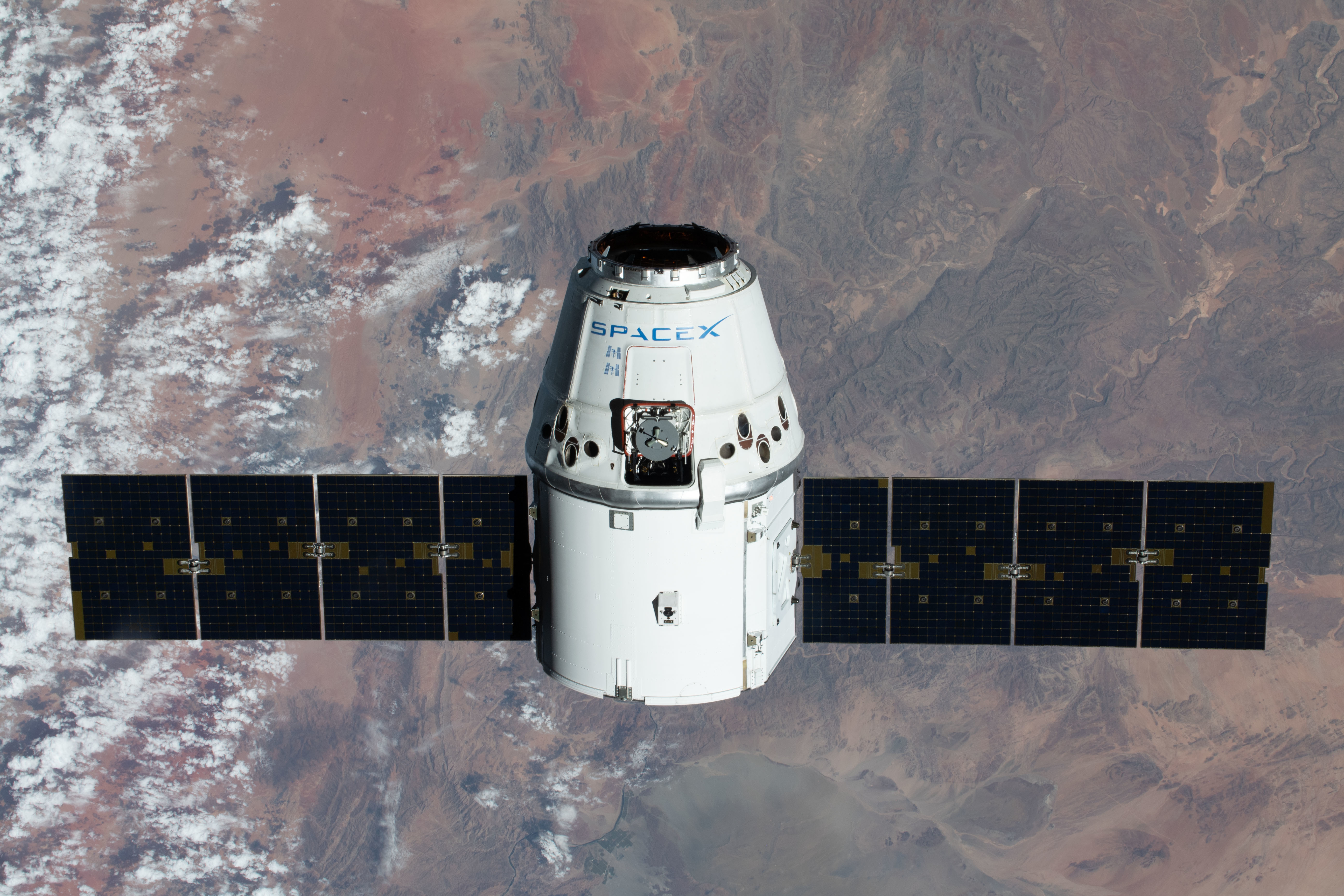 SpaceX CRS-20 mission. The SpaceX Dragon resupply ship is pictured approaching the International Space Station as both spacecraft were soaring 267 miles above the African nation of Namibia.